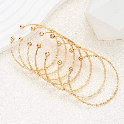 Noverlla™ 7-Piece Gold Heart Bracelet Set – Trendy Fashion Bangles for Women