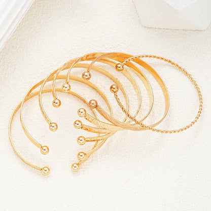 Noverlla™ 7-Piece Gold Heart Bracelet Set – Trendy Fashion Bangles for Women